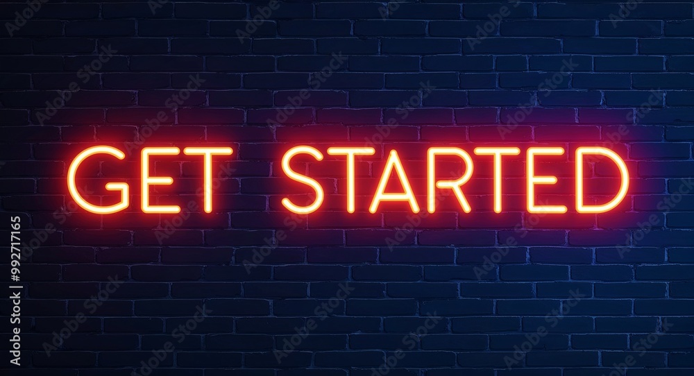 Obraz premium Get started word lettering glowing with neon light on dark brick wall background
