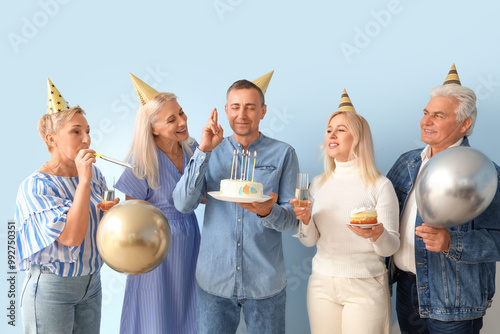 Mature people with cake and...