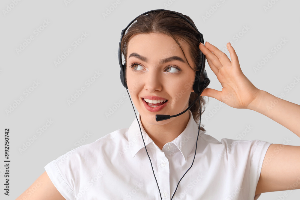 Female technical support agent on light background Female technical support agent on light background