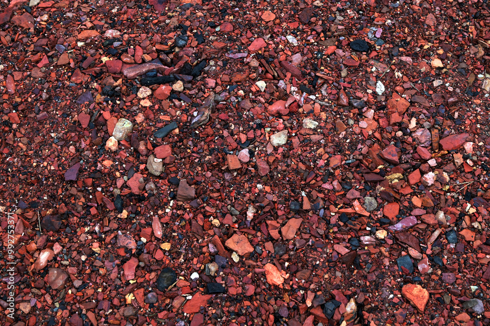 Decorative uniform coating of red crushed stone. Decorative uniform coating of red crushed stone.