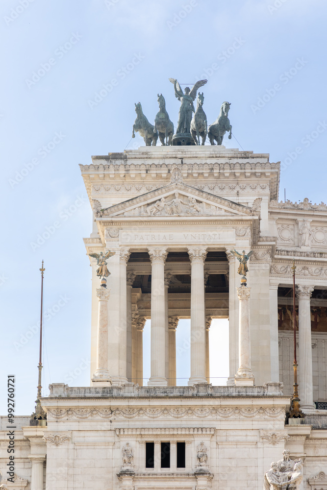 Obraz premium Rome, Italy - April 11, 2024: Rome, Italy - April 11, 2024: monument to Vittorio Emanuele with tourists strolling through the streets in Rome, Italy