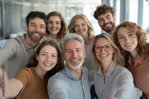 Mixed-age group of colleagues taking a selfie during a team-building activity, office setting, intergenerational collaboration, teamwork