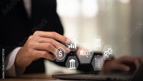 Accountant showing office document auditing concept ,plan review process and assess correctness ,Management of important document storage of organization ,document system ,accountant Audit documents.