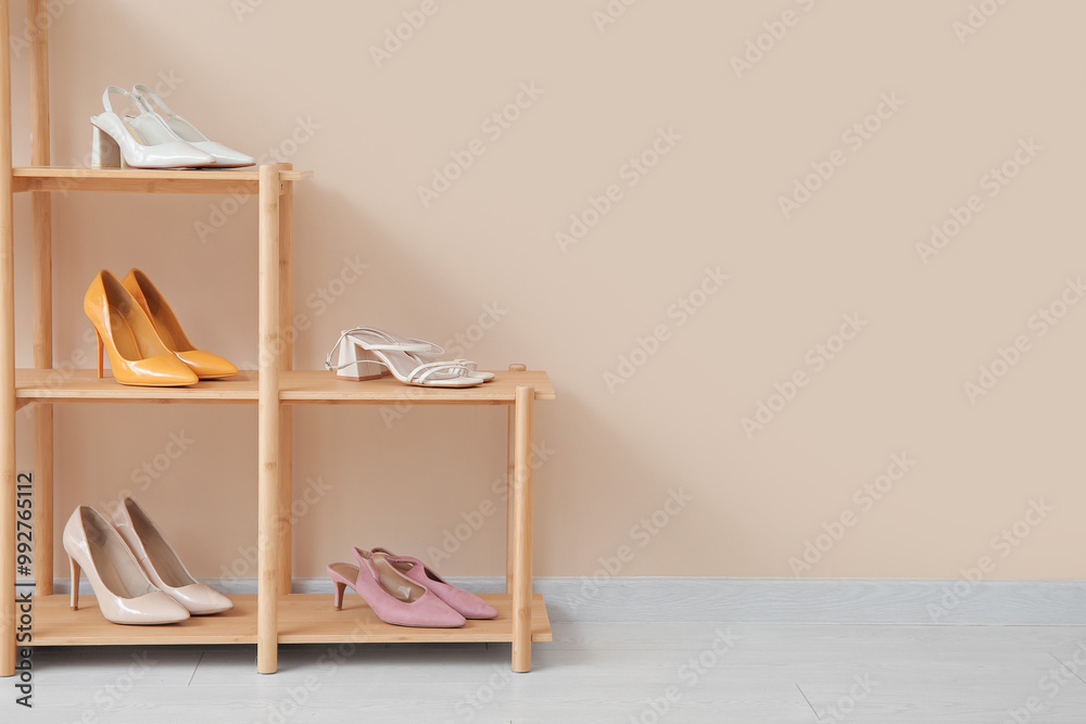 Fototapeta premium Shelving unit with stylish female shoes in boutique