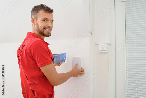Male worker with tablet com...
