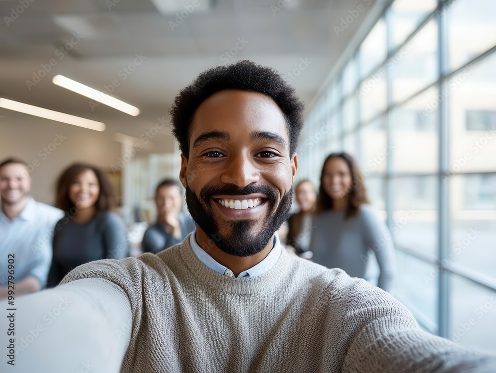 Colleagues taking a selfie in an office meeting room with large windows, natural light, corporate meeting, professional teamwork