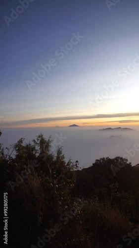 The beauty of the sunrise in the morning with a stretch of clouds at an altitude of 2821 meters above sea level, Mount Cikuray Garut Indonesia photo