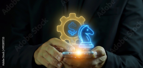 Business Strategy concept, specific ways in which an organisation plans to position itself, achieve its short term and long term goals. Businessman shows Business Strategy icon on virtual screen. photo