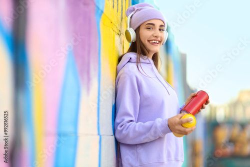 Teenage girl with spray pai...