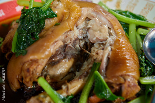 Pork Leg Stewed in gravy soup (Khao kha mu) with lettuce photo