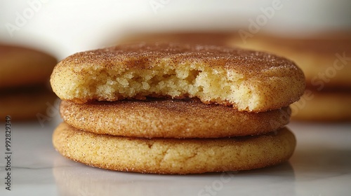 A Stack of Three Brown Sugar Cookies with One Bitten