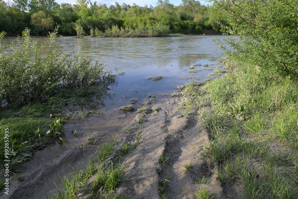 Flooded dirt road after a flood. Flooded dirt road after a flood.