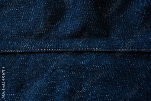 Tableau sur toile Raw blue denim jeans texture background with seam line in the middle