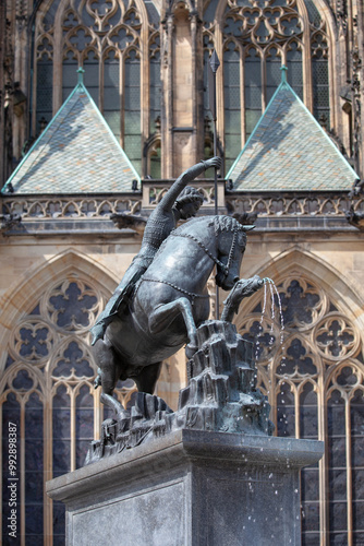 Courtyard of Prague Castle with statue and fountain of Saint George in front of Saint Vitus Cathedral on Hradcany, Prague, Czech Republic