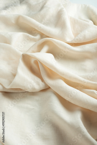 stonewashed linen fabric in dark cream color photo