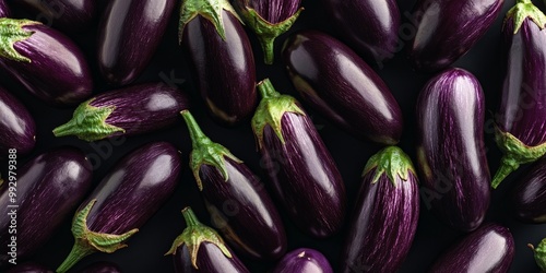 Wallpaper Mural Fresh and vibrant eggplants arranged neatly on a dark surface. Perfect for recipes or food photography. A beautiful display of color and texture. Healthy and versatile vegetables. AI Torontodigital.ca