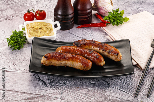 Delicous natural roasted sausages in the plate