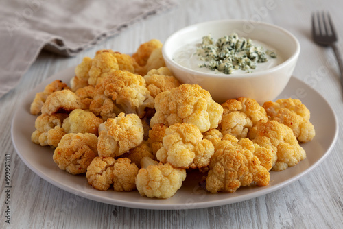 Homemade Buffalo Cauliflower with Blue Cheese Sauce, side view.