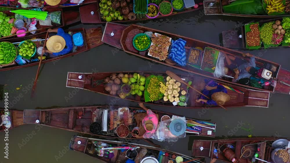 Aerial view Damnoen Saduak floating market, Farmer go to sell organic product, fruit, vegetable and Thai cuisine, Tourist visiting by boat, Ratchaburi, Thailand, Famous floating market in Thailand.