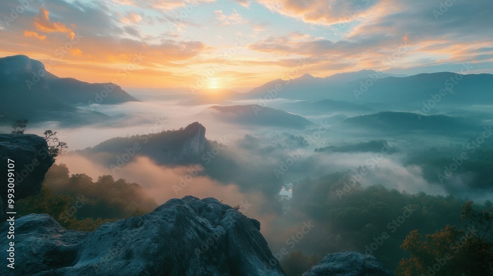 Fototapeta premium hazy panorama of the landscape. Wonderfully surreal dawn on rugged peaks, offering a glimpse of the foggy valley beneath. cloud cover above the forest. A view of the fanciful countryside below. 