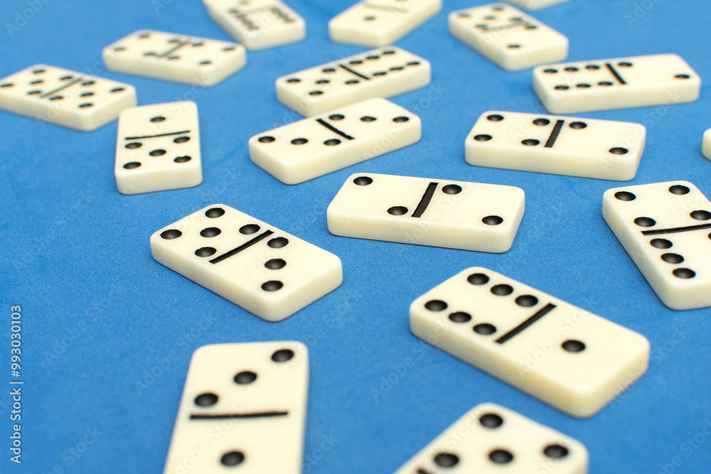 Dominoes bones on blue background Dominoes bones on blue background