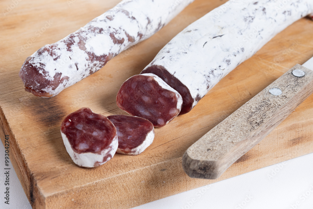 Fuet.Dry cured fuet sausage isolated on white background Fuet.Dry cured fuet sausage isolated on white background