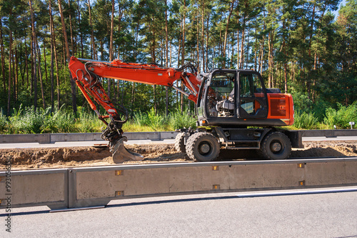 Obraz na płótnie Ein Bagger auf einer Baustelle auf einer deutschen Autobahn w salonie