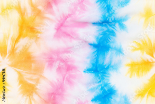 Seamless tie-dye pattern with vibrant yellow, pink, and blue colors creating an intricate design