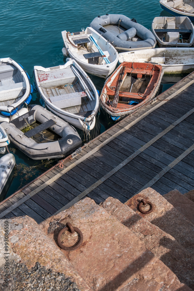 custom made wallpaper toronto digitalGroup of small boats moored at a wooden quay with granite steps leading down to the water. St. Aubin's Harbour, Jersey, Channel Islands.