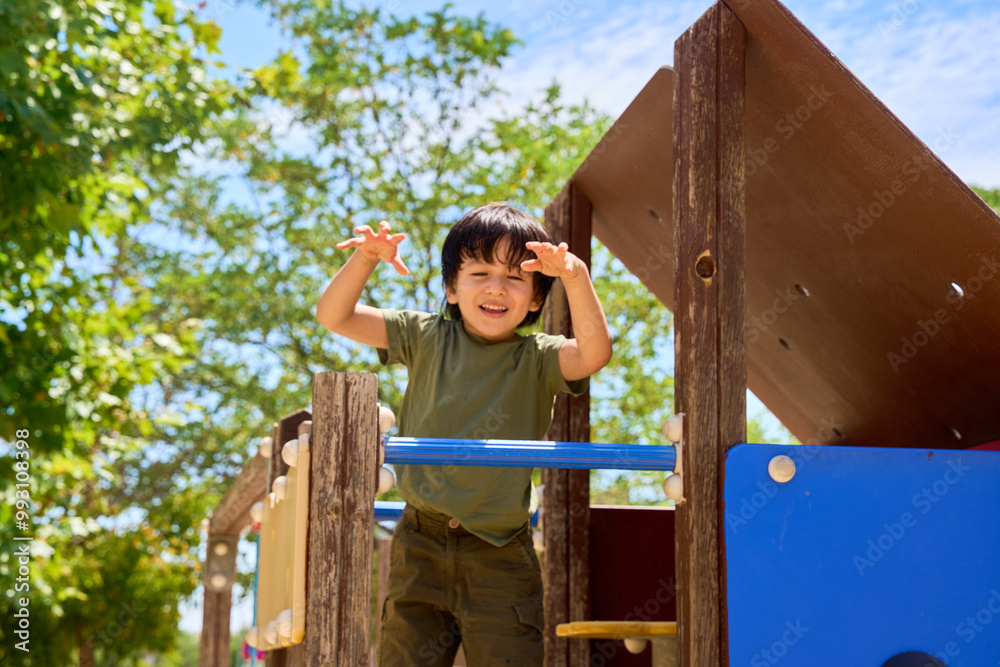child playing in an outdoor playground child playing in an outdoor playground