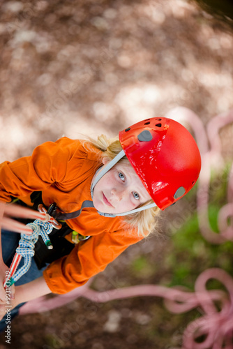 Young girl dangling from a rope - high angle
 photo