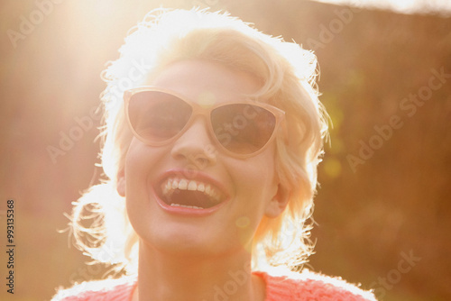 Smiling Young Woman Outdoors, Close-up View
 photo