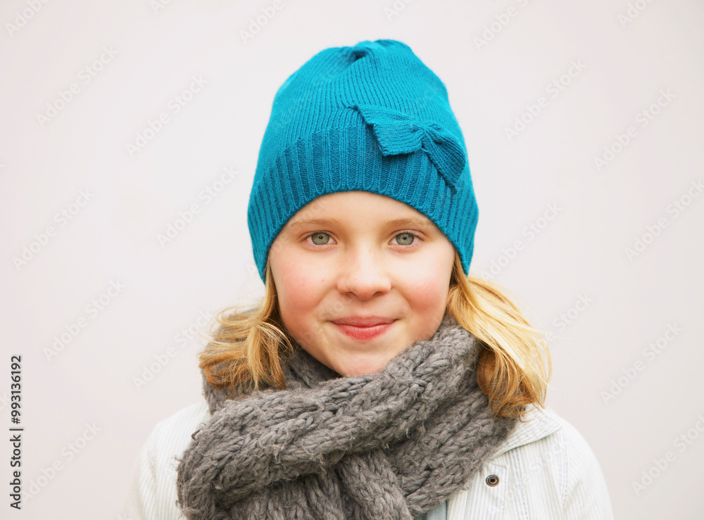 Portrait of Young Girl Wearing Wool Hat and Scarf
