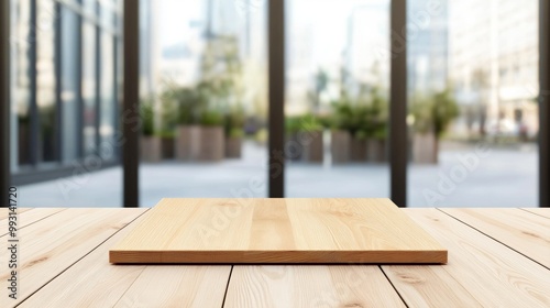 A wooden table with a smooth surface stands prominently against a backdrop of a modern urban landscape in daylight.