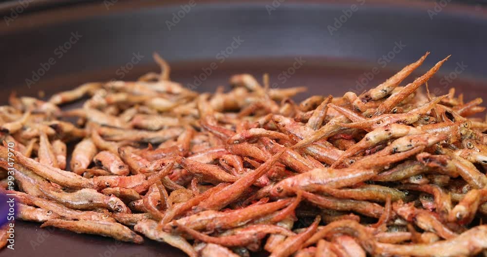 Street food small fried fish in a pan is very popular among street food. Golden fried fish. Street food small fried fish in a pan is very popular among street food. Golden fried fish.