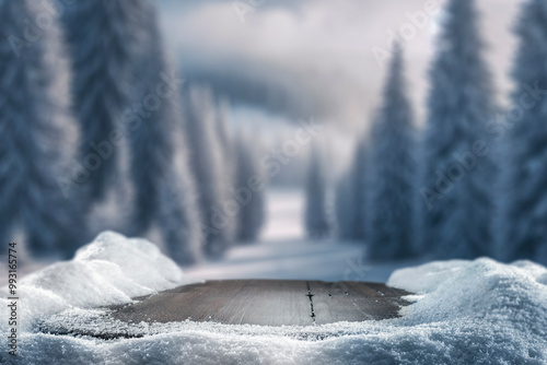 Empty wooden table top coverd with snow with copy space and winter snowing trees and mountain background.