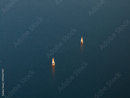 Two Sailboats on Calm Open Water