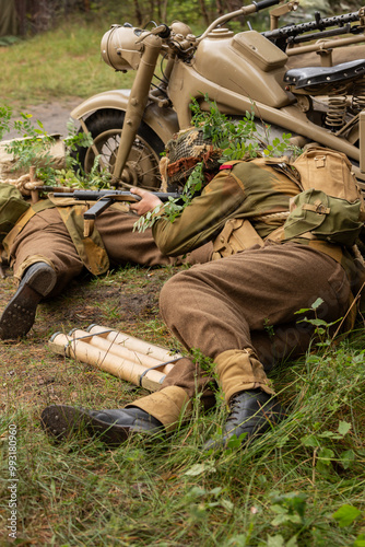 Reconstruction of battle from the Second World War. British paratrooper soldiers during combat. photo