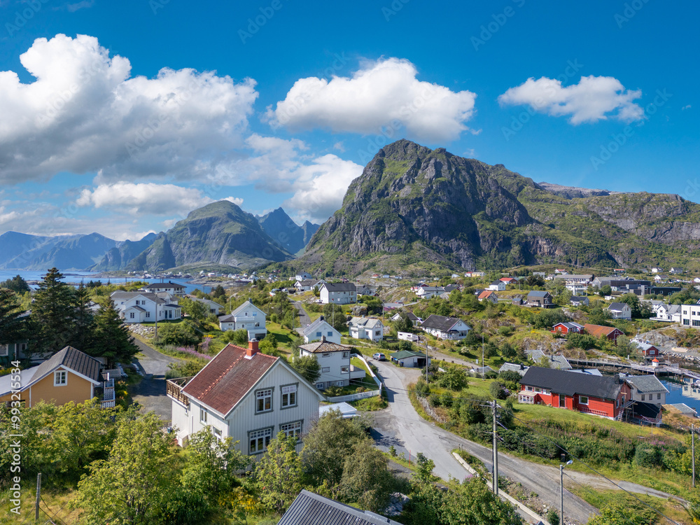 Obraz premium Aerial view, villagescape of Sorvagen in middle of rugged landscape. Lofoten district in Norway