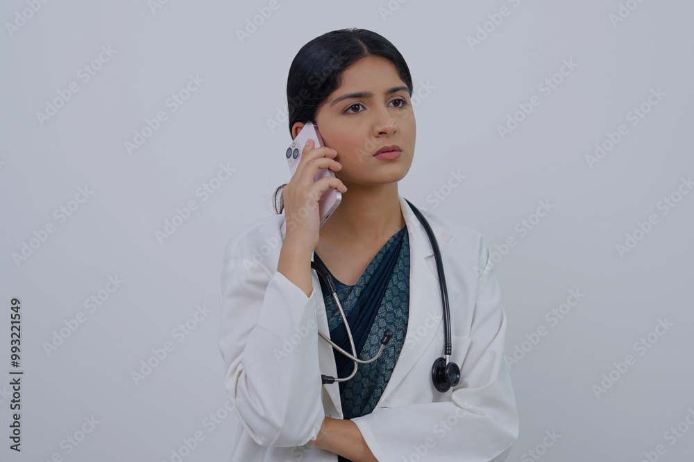 Indian Female Doctor Talking on Phone Call Indian Female Doctor Talking on Phone Call