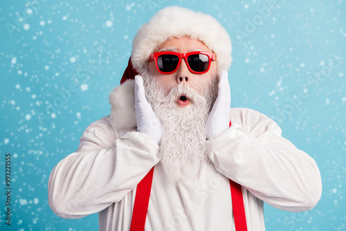 Close-up portrait of his he nice attractive amazed impressed white-haired father Santa incredible unexpected season sale isolated over bright vivid shine vibrant blue color background