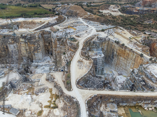 Aerial view of a marble quarry in Vila Viçosa, Alentejo, showcasing expansive stone extraction areas and stunning natural landscapes, ideal for commercial and artistic projects. photo