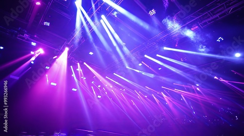 The stage was lit up in bright purple and blue lights, which made it look exciting and full of energy for the show.