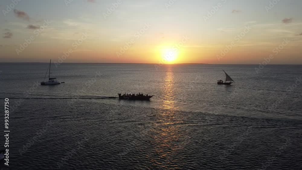 Sunset at the horizon of the Indian Ocean, Zanzibar - Tanzania Sunset at the horizon of the Indian Ocean, Zanzibar - Tanzania