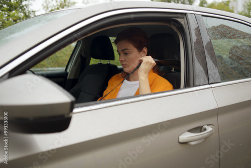 Portrait of a girl driving a car in the city. traveling by automobile and enjoying road trip