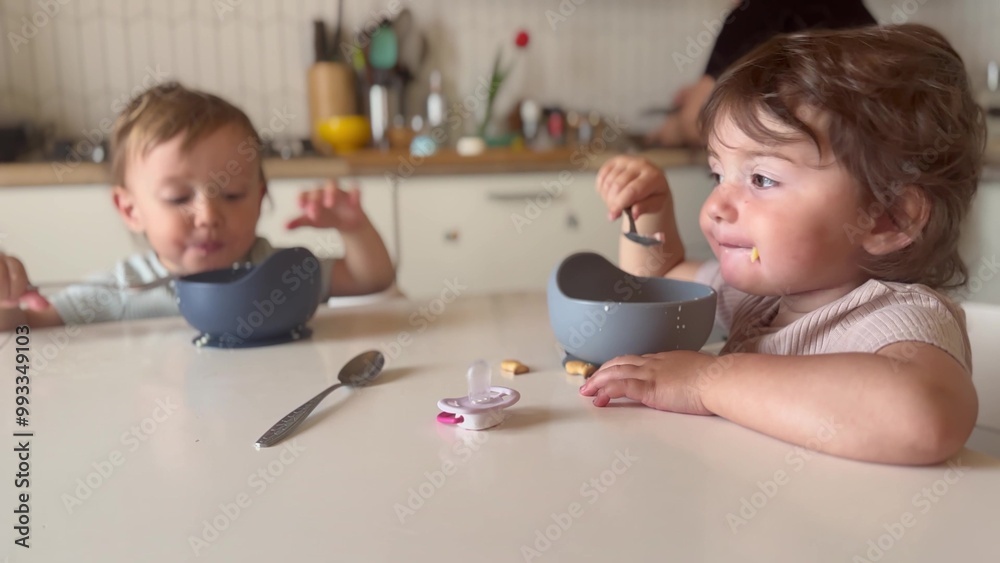 children eat breakfast. happy family kid dream concept. children in a family sit at the table and eat. little toddlers boy and girl eating food early lifestyle in the morning children eat breakfast. happy family kid dream concept. children in a family sit at the table and eat. little toddlers boy and girl eating food early lifestyle in the morning