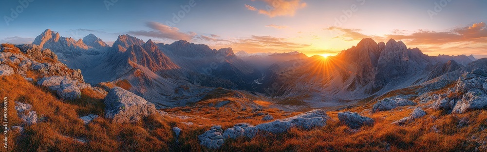 Obraz premium Panoramic view of mountain range during autumn sunrise
