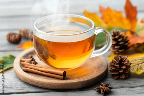 Autumn Tea with Cinnamon and Pine Cones on Wooden Tray