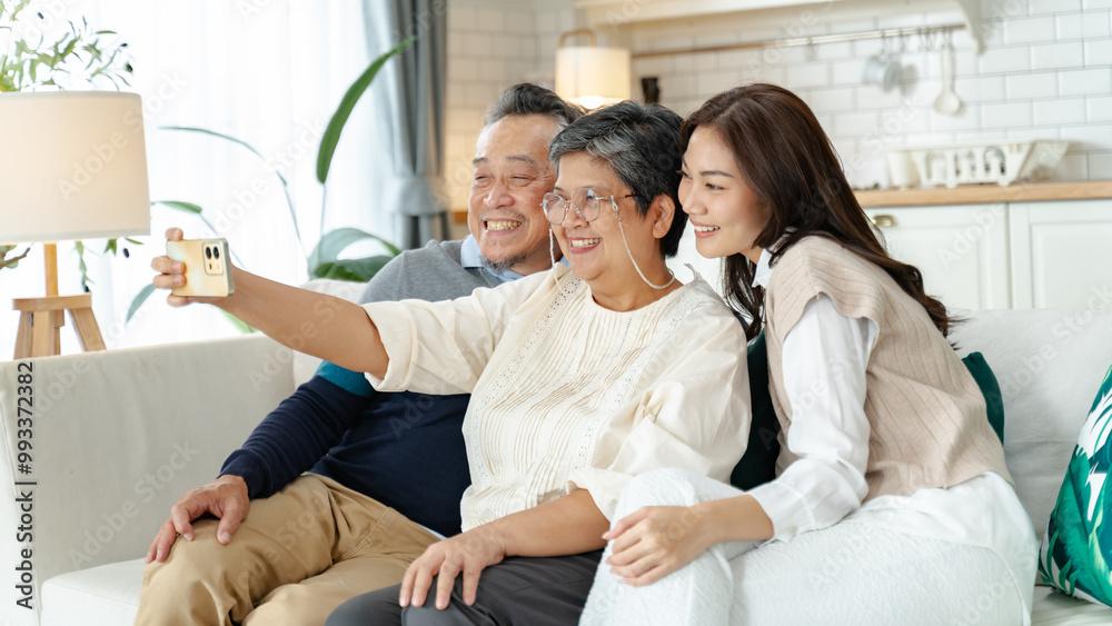 asian beautiful daughter and senior father and mother enjoying conversation and good time at home.happiness family and holiday at home,mother day concept.loving asian adult daughter sitting on couch asian beautiful daughter and senior father and mother enjoying conversation and good time at home.happiness family and holiday at home,mother day concept.loving asian adult daughter sitting on couch