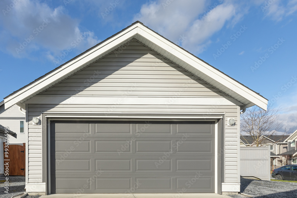 Garage Door. Modern house with garage door. Family house with wide garage door and concrete driveway in front. Garage Door. Modern house with garage door. Family house with wide garage door and concrete driveway in front.